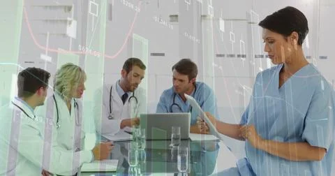 Image of statistics and financial data processing over diverse doctors using Stock Photos
