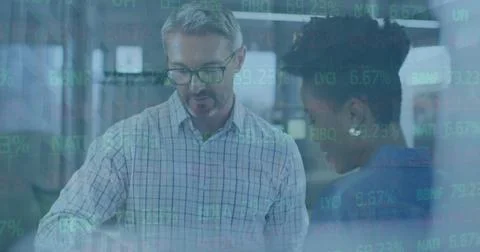 Image of statistics and financial data processing over diverse business people Stock Photos