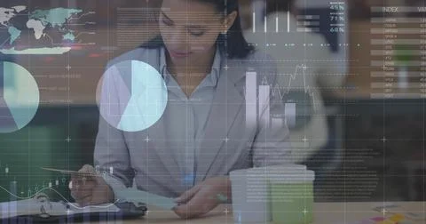 Image of statistics and financial data processing over biracial businesswom.. Foto stock