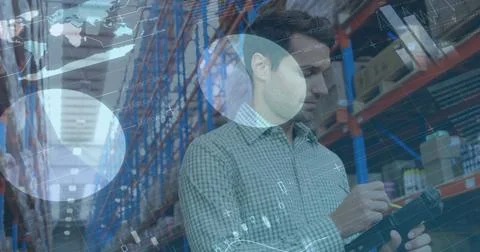 Image of statistics and financial data processing over man working in warehouse Stock Photos