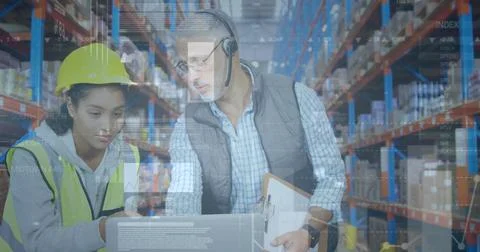 Image of statistics and financial data processing over man and woman working in Stock Photos