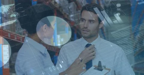 Image of statistics and financial data processing over man and woman working in 写真素材