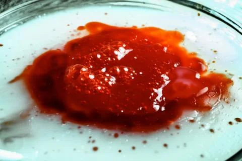 Image of sticky bubbled red muck, close-up Stock Photos
