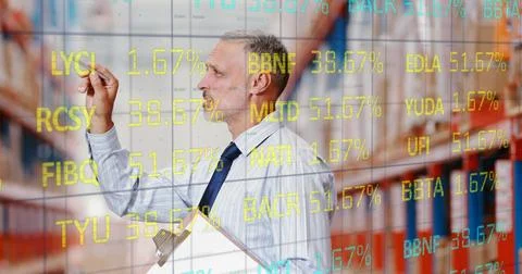 Image of stock exchange numbers over man counting stock in warehouse holding Ilustração Stock