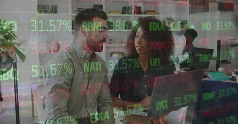 Image of stock market data processing over diverse man and woman discussing at Stock Photos