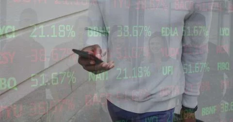 Image of stock market data processing over mid section of man using smartphone 스톡 사진