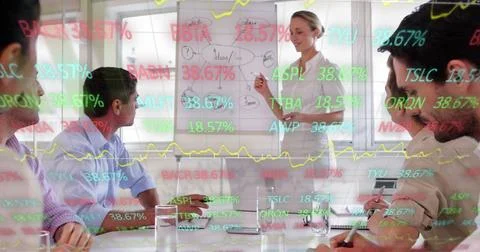 Image of stock market data processing over caucasian woman giving a presentation Stock Photos