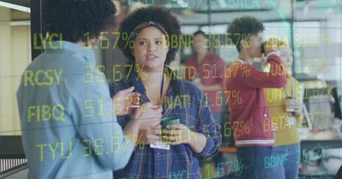 Image of stock market data processing over diverse man and woman discussing at Foto stock