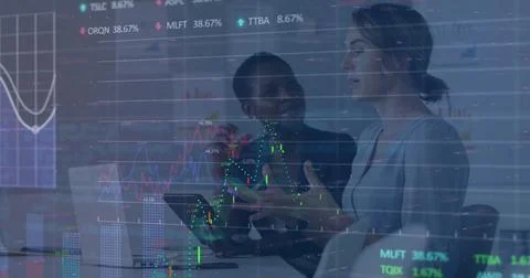 Image of stock market data processing against two diverse women discussing at Foto stock