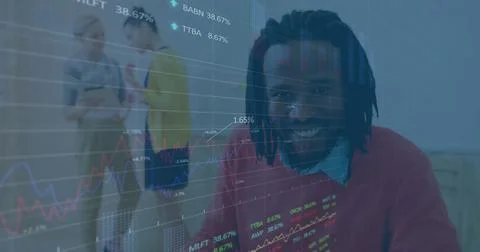 Image of stock market data processing over african american man taking notes at 库存照片