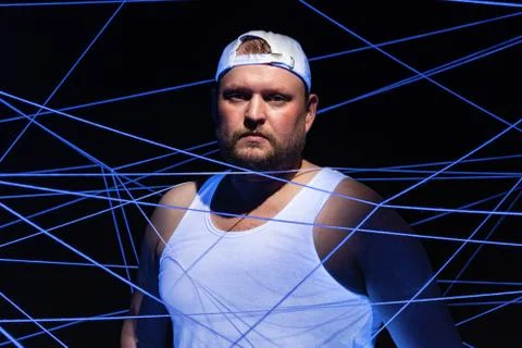 Image of stout man with white threads in ultraviolet Stock Photos