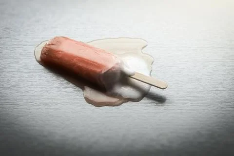 An image of a strawberry popsicle is melting Stock Photos