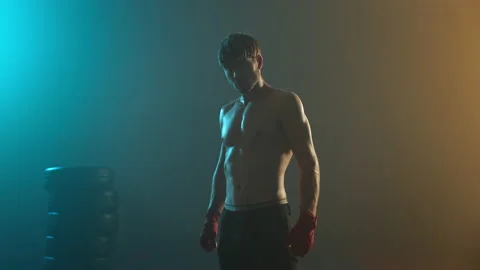 Image Of Strong Boxer In Dark Ring. Young Man Standing With Naked Torso. Stock Footage 160766732