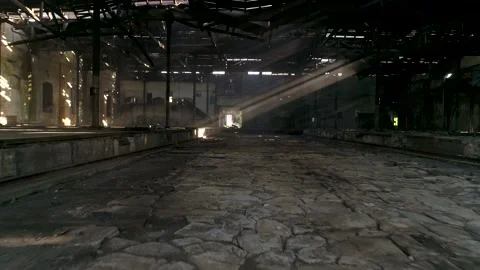 Image of sun rays crossing a scenic abandoned warehouse Stock Footage 148995563