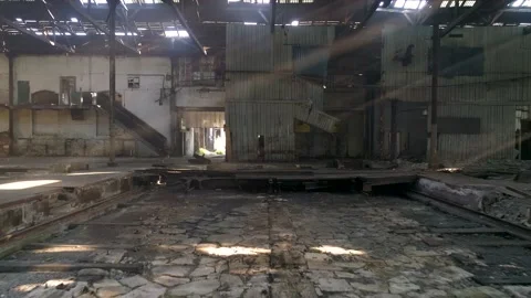 Image of sun rays crossing a scenic abandoned warehouse Video stock 148995729