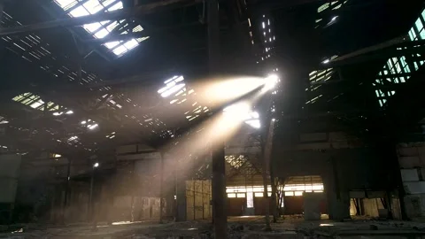 Image of sun rays crossing a scenic abandoned warehouse Stock Footage 148995824
