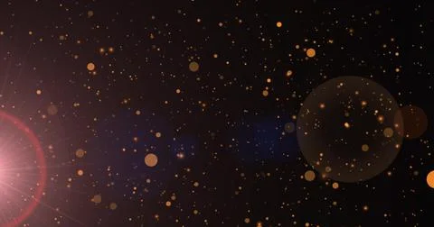 Image of sunrays and golden dots falling on black background Illustrazione stock