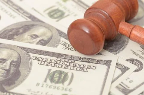 The image symbolizes the intersection of justice and finance, suggesting th.. Stock Photos