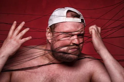 Image of tangled in black threads fat man Stock Photos