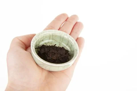 Image of tea cup hand white background Stock Photos