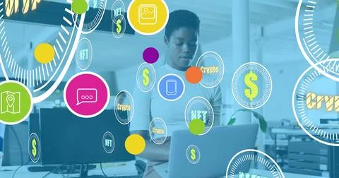 Image of tech icons and crypto over african american woman using laptop in Stock Photos