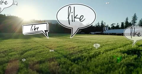 Image of like text on multiple speech bubbles floating against aerial view of Foto stock