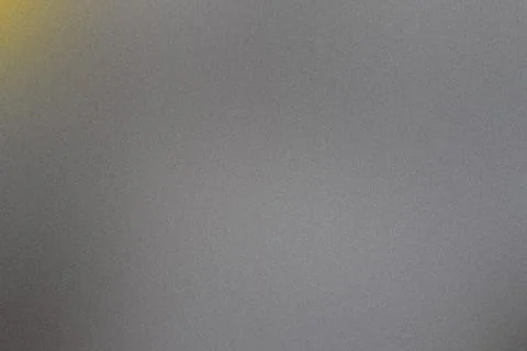 Image of a textured gray background with a subtle gradient and a soft yellow  Stock Photos