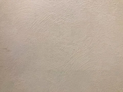 Image of a textured, light tan or beige wall with a subtle linear pattern, po Stock Photos