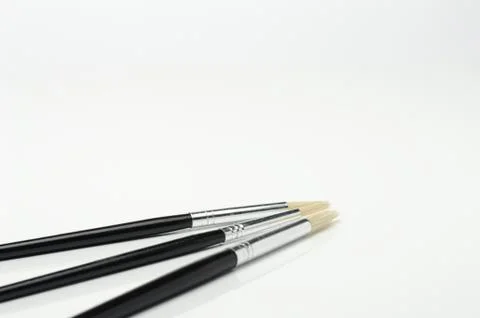 Image of three fine stroke brushes Stock Photos