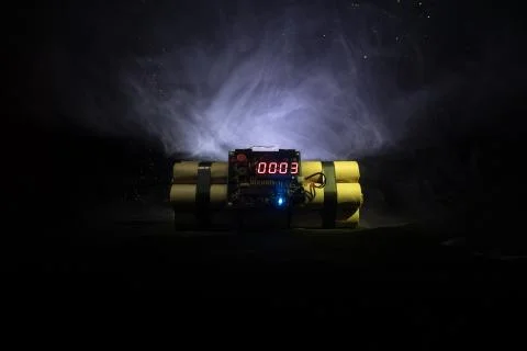 Image of a time bomb against dark background. Timer counting down to detonati Stock Photos