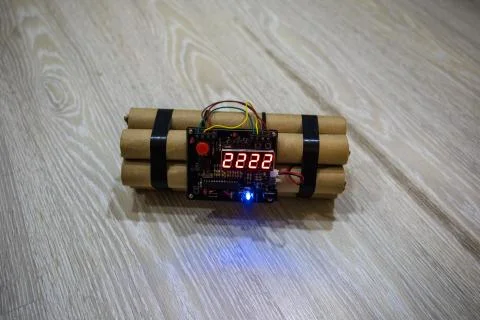 Image of a time bomb on floor. Timer counting down to detonation illuminated  Stock Photos