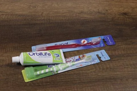 Image of toothpaste Orbitlife toothbrushes in the package. Stock Photos