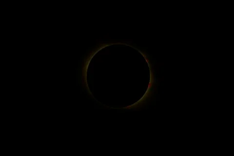 Image of a total solar eclipse taken with a telephoto lens. Stock Photos