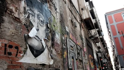 Image of Toto' on wall and wrap clothes in the historical center of Naples Italy Stock Footage 79858252