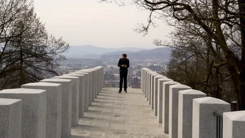 Image of tourist man using a cellphone at Ljubljana city, Slovenia. Stock Footage 105593970