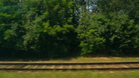 Image of a train moving over rail tracks during the day, Croatia. Vídeo Stock 114684890