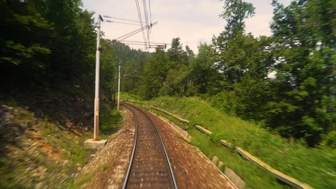 Image of a train moving over rail tracks during the day, Croatia. Video stock 114696956