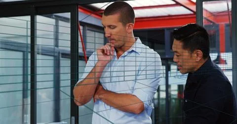 Image of tunnel in seamless pattern over two diverse men discussing at office Stock Photos