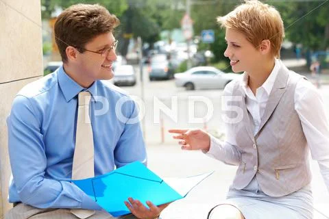 Image of two business partners interacting and planning work Stock Photos
