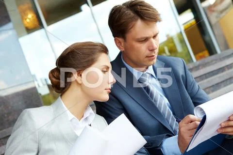 Image of two business partners planning work outdoors Stock Photos