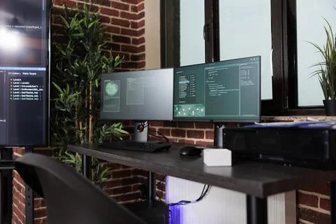 Image of two computer screens displaying software data information and Stock Photos