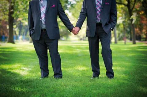 Image of two men Holding hands at gay Wedding Stock Photos
