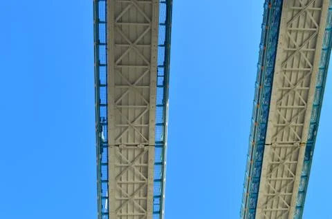 Image of two metal bridges in parallel against the blue sky Stock Photos
