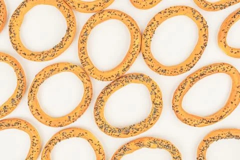 Image of a uniform array of circular, speckled yellow objects resembling donu Stock Photos