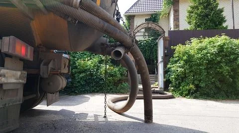 Image of units of a pumping machine for pumping out a septic tank. Sewerage i Stock Photos