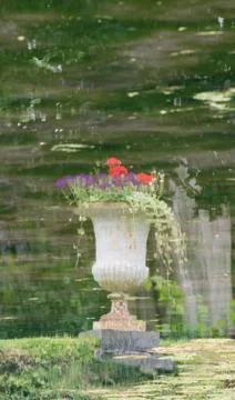 Image of a vase reflected in the water Stock Photos