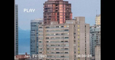 Image of vhs glitch effect over tall buildings in background 스톡 사진