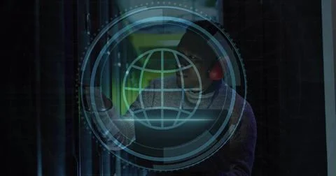 Image of web globe icon over african american male engineer using laptop at.. Stock Photos