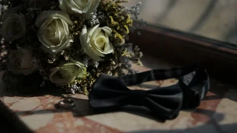 Image from the wedding day, man bow tie and wedding ring, together with a bouque Video stock 204001773