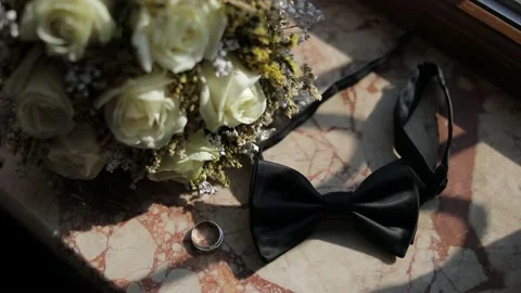 Image from the wedding day, man bow tie and wedding ring, together with a bouque Video stock 204001828